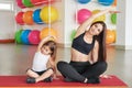 Fitness mother and child. Sports activities with children. Fitness center. Mom and baby gymnastics, yoga exercises. Health and Royalty Free Stock Photo