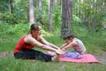 Fitness mother with her 9 years old son. Sports mom with kid doing morning work-out at park. Mum and child do the Royalty Free Stock Photo