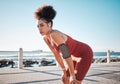 Fitness, music and exhausted with a black woman runner on the promenade for cardio or endurance training. Exercise Royalty Free Stock Photo