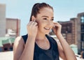 Fitness, music and woman with earpods and smile on rooftop for outdoor workout, exercise or yoga. Sports, training and Royalty Free Stock Photo