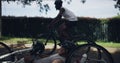 Fitness, person with disability and men on bicycle in park for sports training, cardio workout and exercise. Paralympics
