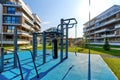 fitness playground with the gymnastic sport equipments near new modern residential buildings