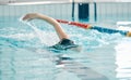 Fitness, pool and woman swimmer training for a swimming race, competition or tournament. Sports, workout and female Royalty Free Stock Photo