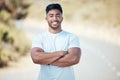 Fitness, portrait and man with arms crossed on a road with happiness from run and sport. Face, smile and confidence from Royalty Free Stock Photo