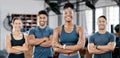 Fitness, portrait and woman personal trainer with a team standing with crossed arms in the gym. Sports, collaboration Royalty Free Stock Photo