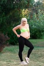 Fitness pregnant woman feeling her baby push