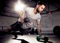 Fitness, push up and man exercise with dumbbells at gym for training workout with focus. Serious male athlete or