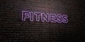 FITNESS -Realistic Neon Sign on Brick Wall background - 3D rendered royalty free stock image