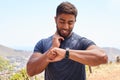 Fitness, running and pulse with man, watch check and training, exercise and wellness app. Workout, heart rate and health