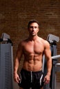 Fitness shaped muscle man posing on gym Royalty Free Stock Photo