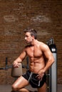 Fitness shaped muscle man posing on gym Royalty Free Stock Photo