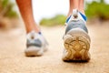 Fitness, shoes and sports person walking, running and man training on path. Back closeup of runner, feet and sneakers on Royalty Free Stock Photo