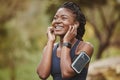 Fitness, smile and black woman listening to music outdoor exercise, workout or training in a forest for wellness. Happy Royalty Free Stock Photo