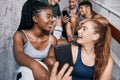 Fitness, social media and friends with phone and networking on stairs for internet, training and health. Communication Royalty Free Stock Photo