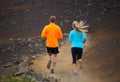 Fitness sport couple running jogging outside on trail Royalty Free Stock Photo