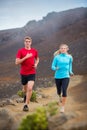 Fitness sport couple running jogging outside on trail Royalty Free Stock Photo