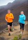 Fitness sport couple running jogging outside on trail Royalty Free Stock Photo