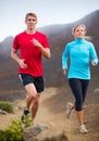 Fitness sport couple running jogging outside on trail Royalty Free Stock Photo