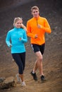 Fitness sport couple running jogging outside on trail Royalty Free Stock Photo