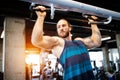 Fitness, sport, exercising and lifestyle concep Young man working out in gym Royalty Free Stock Photo