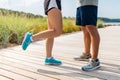 Legs of couple of sportsmen in sneakers outdoors Royalty Free Stock Photo