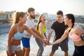 Fitness, sport, friendship and healthy lifestyle concept . Group of happy people exercising Royalty Free Stock Photo