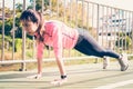 Fitness sport girl fashion sportswear doing yoga fitness exercise in street. Royalty Free Stock Photo