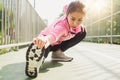 Fitness sport girl fashion sportswear doing yoga fitness exercise in street. Royalty Free Stock Photo