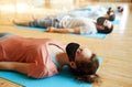 woman in black mask doing group yoga at studio Royalty Free Stock Photo