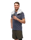 happy man in sports clothes with bottle and towel Royalty Free Stock Photo