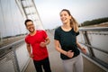 Fitness, sport, people, exercising and lifestyle concept. Couple running outdoor Royalty Free Stock Photo