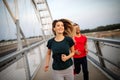 Fitness, sport, people, exercising and lifestyle concept. Couple running outdoor Royalty Free Stock Photo