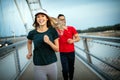 Fitness, sport, people, exercising and lifestyle concept. Couple running outdoor Royalty Free Stock Photo