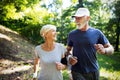 Fitness, sport, people, exercising and lifestyle concept - senior couple running Royalty Free Stock Photo