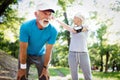 Fitness, sport, people, exercising and lifestyle concept - senior couple running Royalty Free Stock Photo