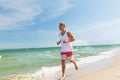 Happy man running along summer beach Royalty Free Stock Photo