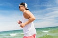 Happy man running along summer beach Royalty Free Stock Photo