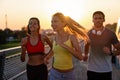 Fitness sport people running lifestyle concept. Group of young people jogging together outdoors. Royalty Free Stock Photo