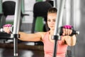 Fitness, sport, powerlifting and people concept - sporty woman doing workout in gym. Royalty Free Stock Photo