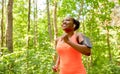 african woman with earphones running at park Royalty Free Stock Photo