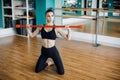 Fitness, sport, training, gym and lifestyle concept - group of women excercising with bars in gym Royalty Free Stock Photo