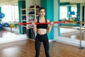 Fitness, sport, training, gym and lifestyle concept - woman excercising with bars in gym Royalty Free Stock Photo