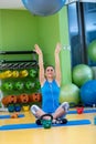 Fitness, sport, training, gym and lifestyle concept - young woman doing exercise on fitness ball Royalty Free Stock Photo