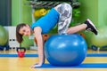 Fitness, sport, training, gym and lifestyle concept - young woman doing exercise on fitness ball Royalty Free Stock Photo