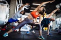 Fitness, sport, training and lifestyle concept. Group of people exercising in gym Royalty Free Stock Photo