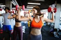 Fitness, sport, training and lifestyle concept. Group of people exercising in gym Royalty Free Stock Photo