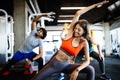 Fitness, sport, training and lifestyle concept. Group of people exercising in gym Royalty Free Stock Photo