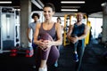 Fitness, sport, training and lifestyle concept. Group of people exercising in gym Royalty Free Stock Photo