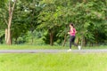 Fitness sport woman running on the path trail in the park in morning. Royalty Free Stock Photo