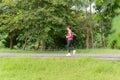 Fitness sport woman running on the path trail in the park in morning. Royalty Free Stock Photo